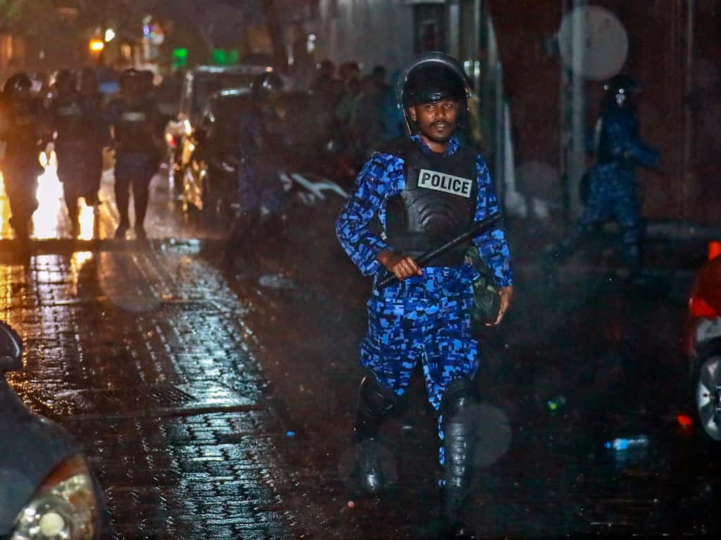 A Maldives policeman charges with baton towards protesters after the government declared a 15-day state of emergency in Male, Maldives, early on February 6, 2018. (Photograph: AP/PTI)