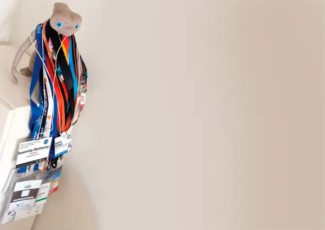 Spielberg’s ET hangs with Mohanty’s many badges.<br />
(Courtesy of Susmita Mohanty)