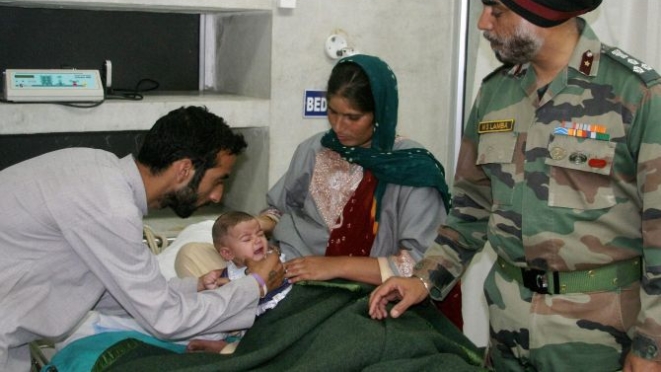 A soldier’s infant receives medical care.