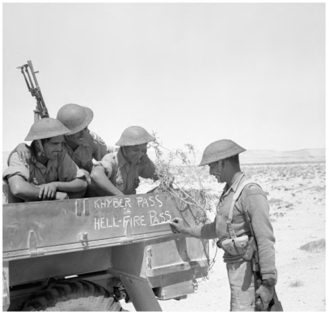 Soldiers of the Fourth Indian Division decorate the side of their lorry with the words: “From Khyber Pass to Hellfire Pass”. Hellfire Pass was the&nbsp; nickname for the strategic Al-Halfaaya Pass in Egypt which the Indians tried to wrest from the Germans.